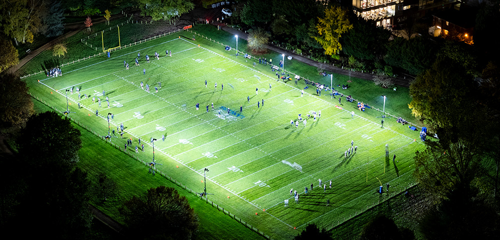 Oxford University NFL Football 8 Ritelite Quad Pod K65 mobile lighting towers lighting up a football pitch for winter outdoor training