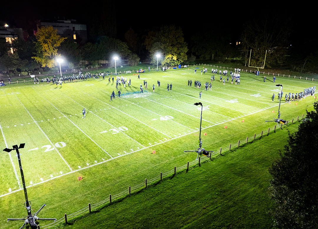 Oxford University NFL Football Ritelite Quad Pod K65 mobile lighting towers lighting up an NFL football field for winter training