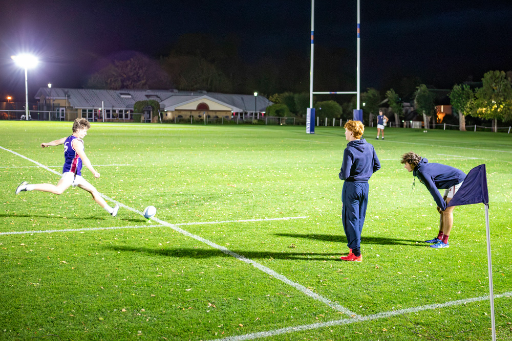 Oundle School Ritelite Quad Pod K65 mobile lighting towers lighting up a field for evening outdoor winter rugby practice